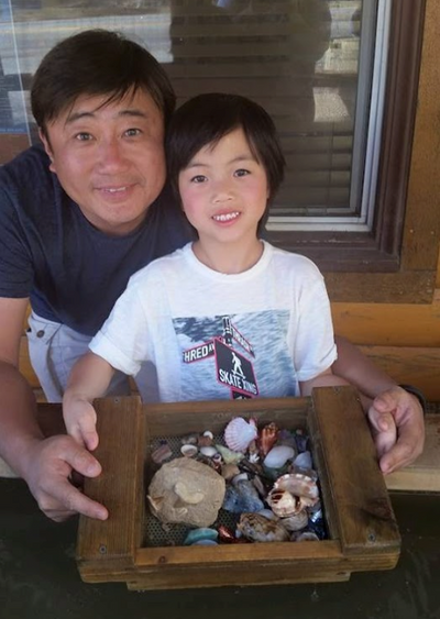 father and daughter showing their treasure